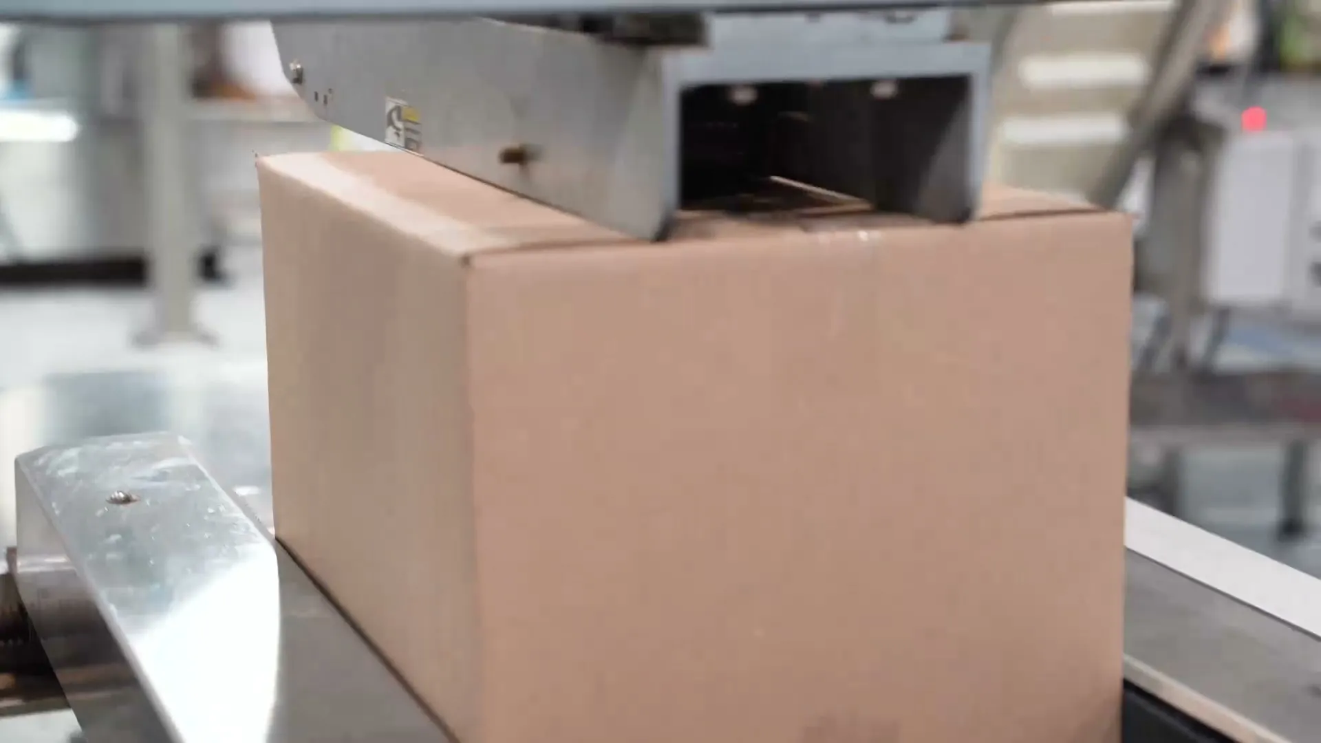 A case moving through the case sealer