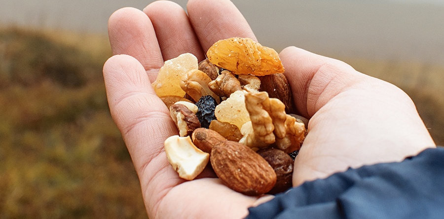 Performance Co-Packing expert Co-Packing Solutions Showing Handful of Dried Fruit and Mixed Nuts