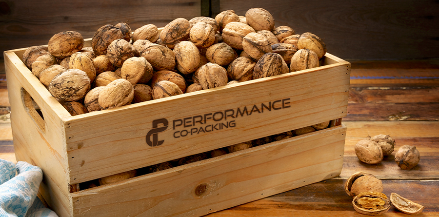 Performance Co-Packing innovating since 2016. Crate of Walnuts